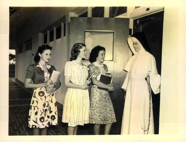 Sister Mary Paul meeting and greeting students at the door